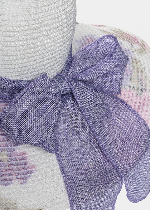White hat with purple flowers and ribbon